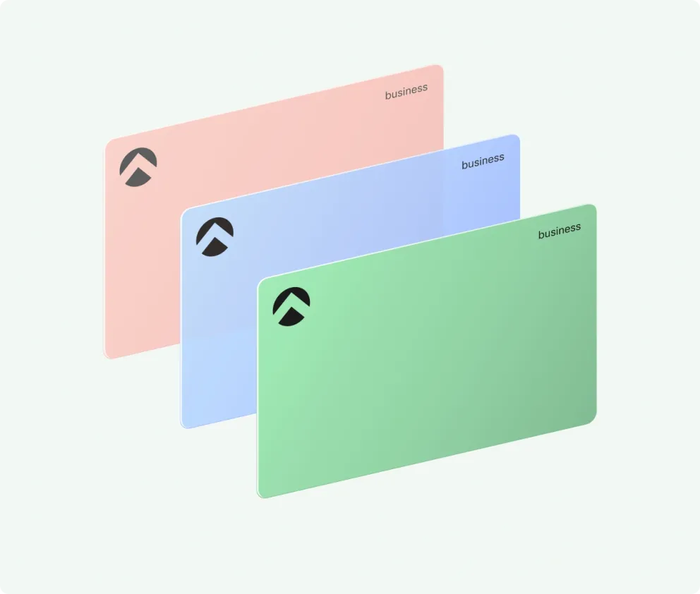 Three Aspire business cards in coral, blue and mint, one behind the other