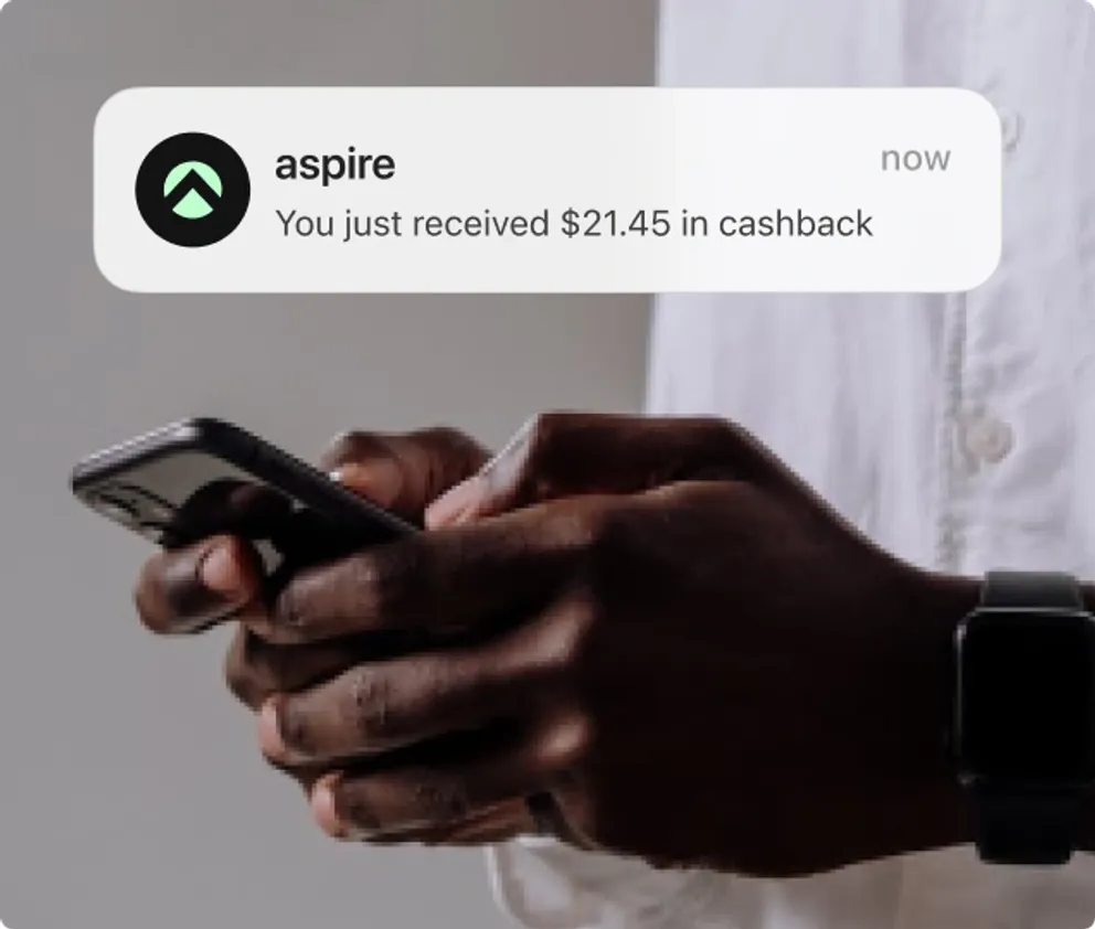 A phone showing an Aspire notification that cashback has been received