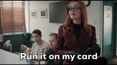 A woman in an office glances over, captioned run it on my card