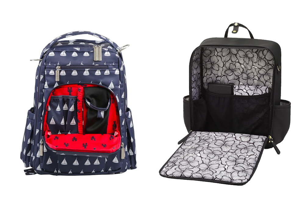 Two diaper backpacks opened out: one with a lined front compartment, one with a fold-down changing mat