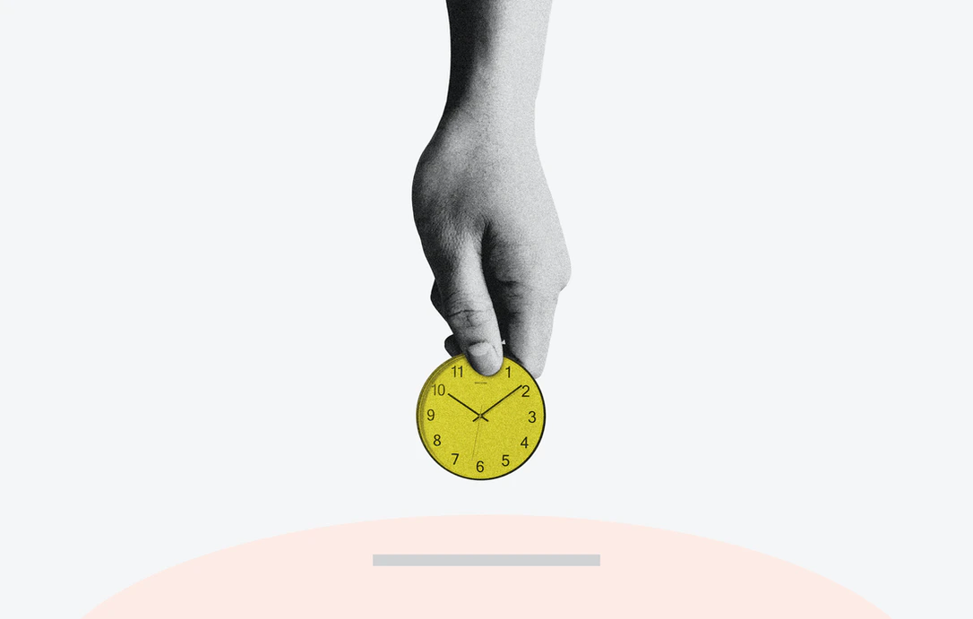 Person inserting a clock into a piggy bank